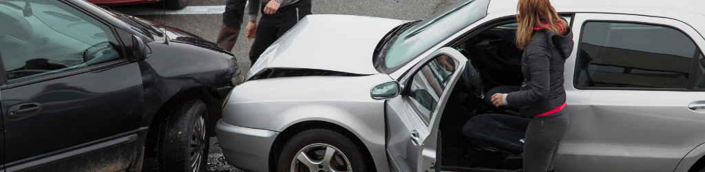 Woman exiting a car after an accident.