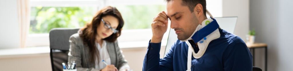 woman lawyer meeting with client with injured neck