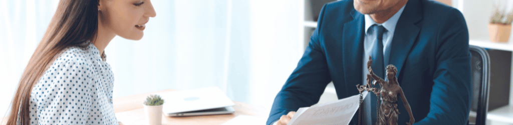 smiling lawyer showing papers to happy client in office