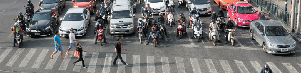 People crossing the pedestrian lane.