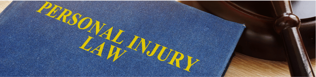 A blue book titled 'Personal Injury Law'