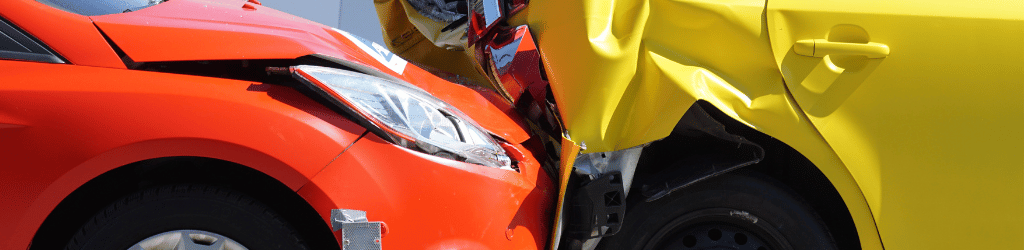 Yellow and red car involved in accident.